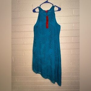 Jennifer Lopez Teal Garment with Vibrant Red Accents